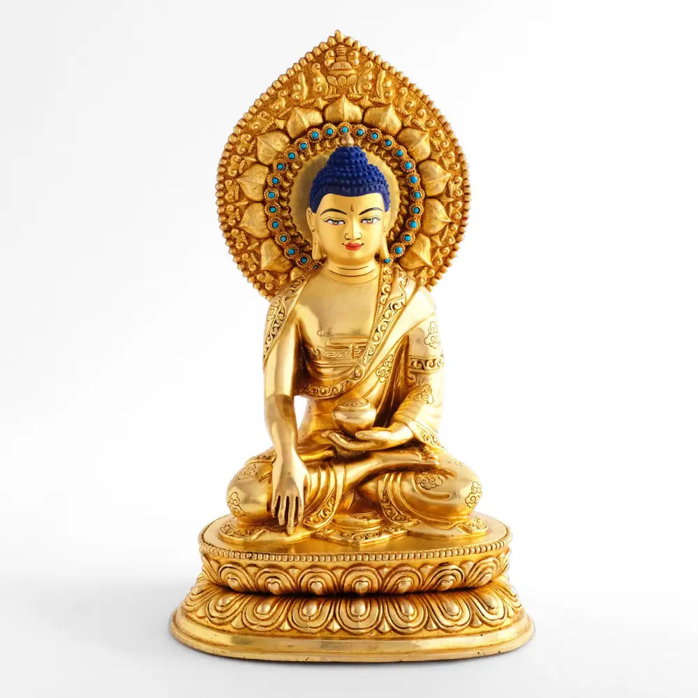 Verrgoldete Buddha-Statue mit blauem Haar ud tropfenförmigem Nimbus.