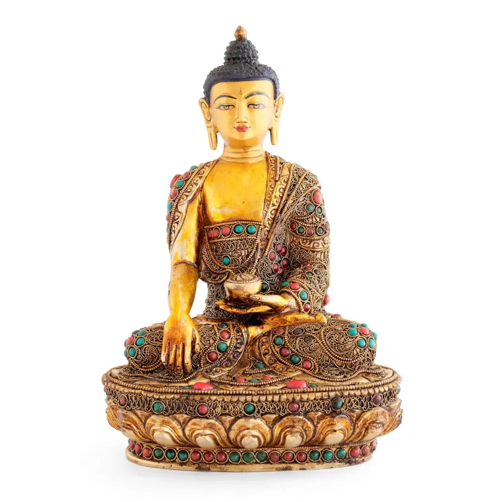 Vergoldete Shakyamuni Buddha Statue mit farbigen Steinen akzentuiert.