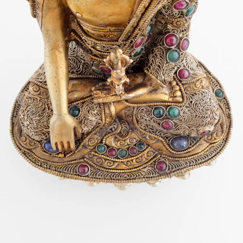 Akshobhya Buddha - Statue, he holds an upright Vajra in his left hand.