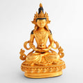 Small gold-plated statue of Amitayus Buddha seated in meditation posture holding the vase of long life.