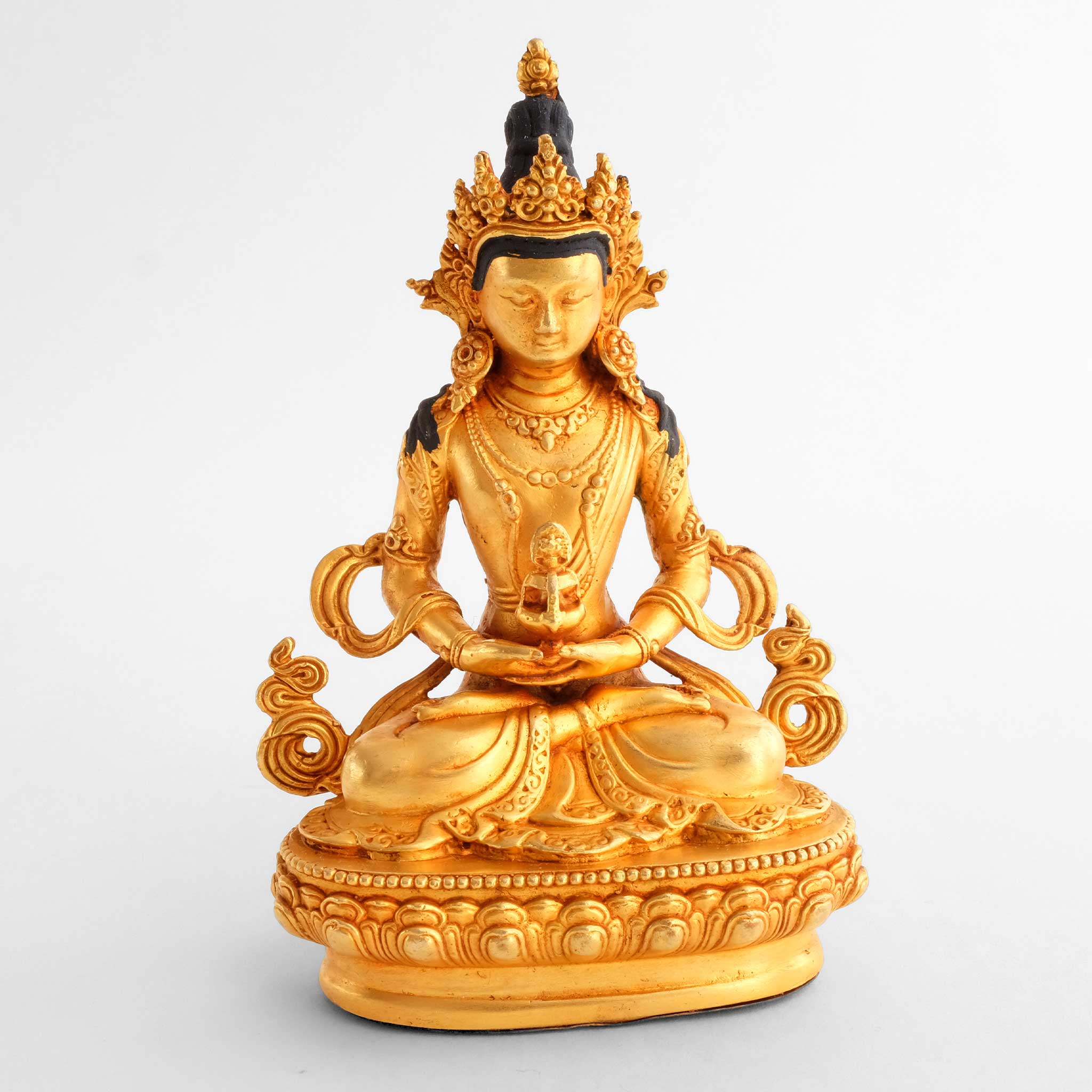 Small gold-plated statue of Amitayus Buddha seated in meditation posture holding the vase of long life.