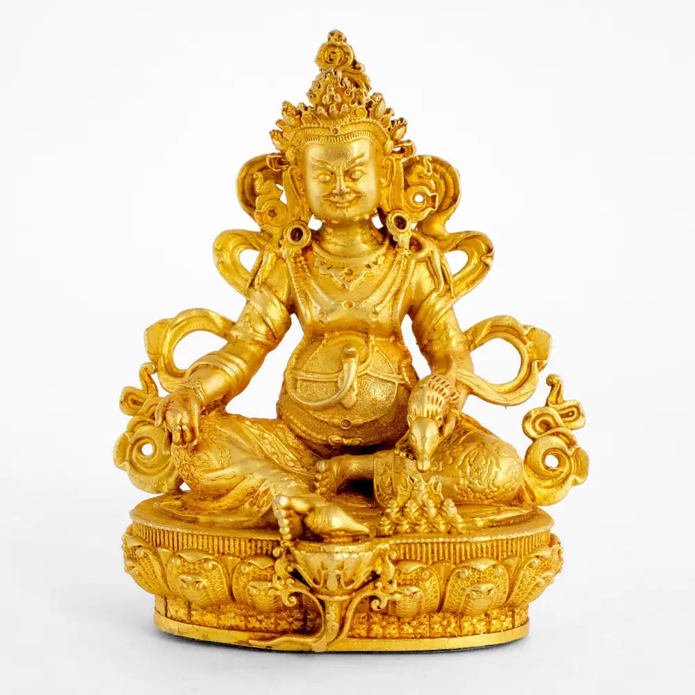 Goldene Jambhala-Statue. Kleine detaillierte Kupferstatue.