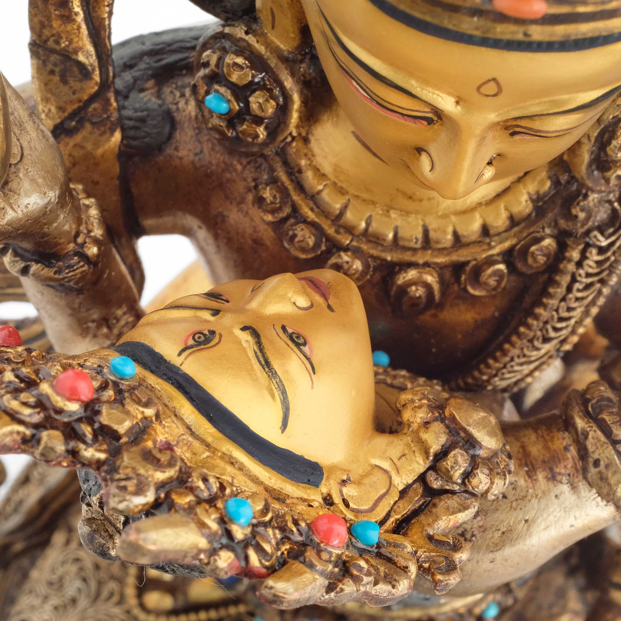 Detailaufnahme von der Gesichter, Schmuck der Manjushri Yab Yum Statue