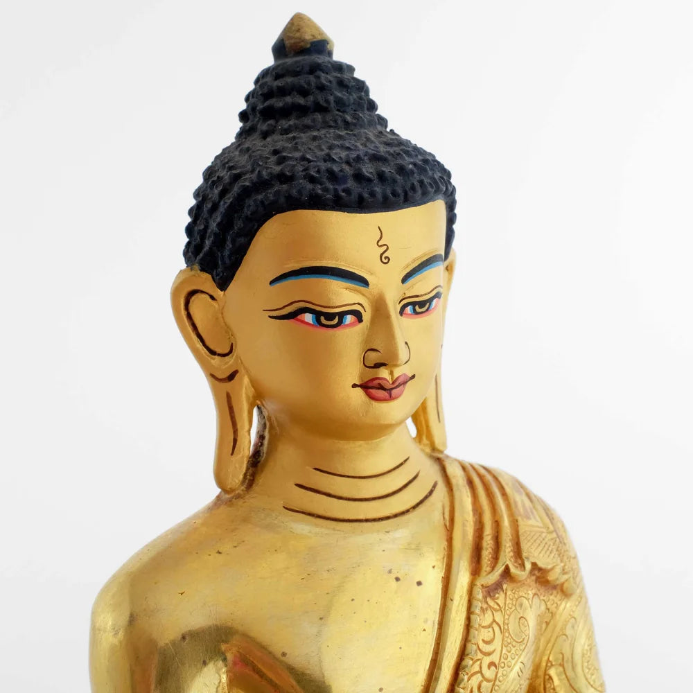 Shakyamuni Buddha, sein Gesicht ist in Gold gefasst, feuervergoldete Statue.