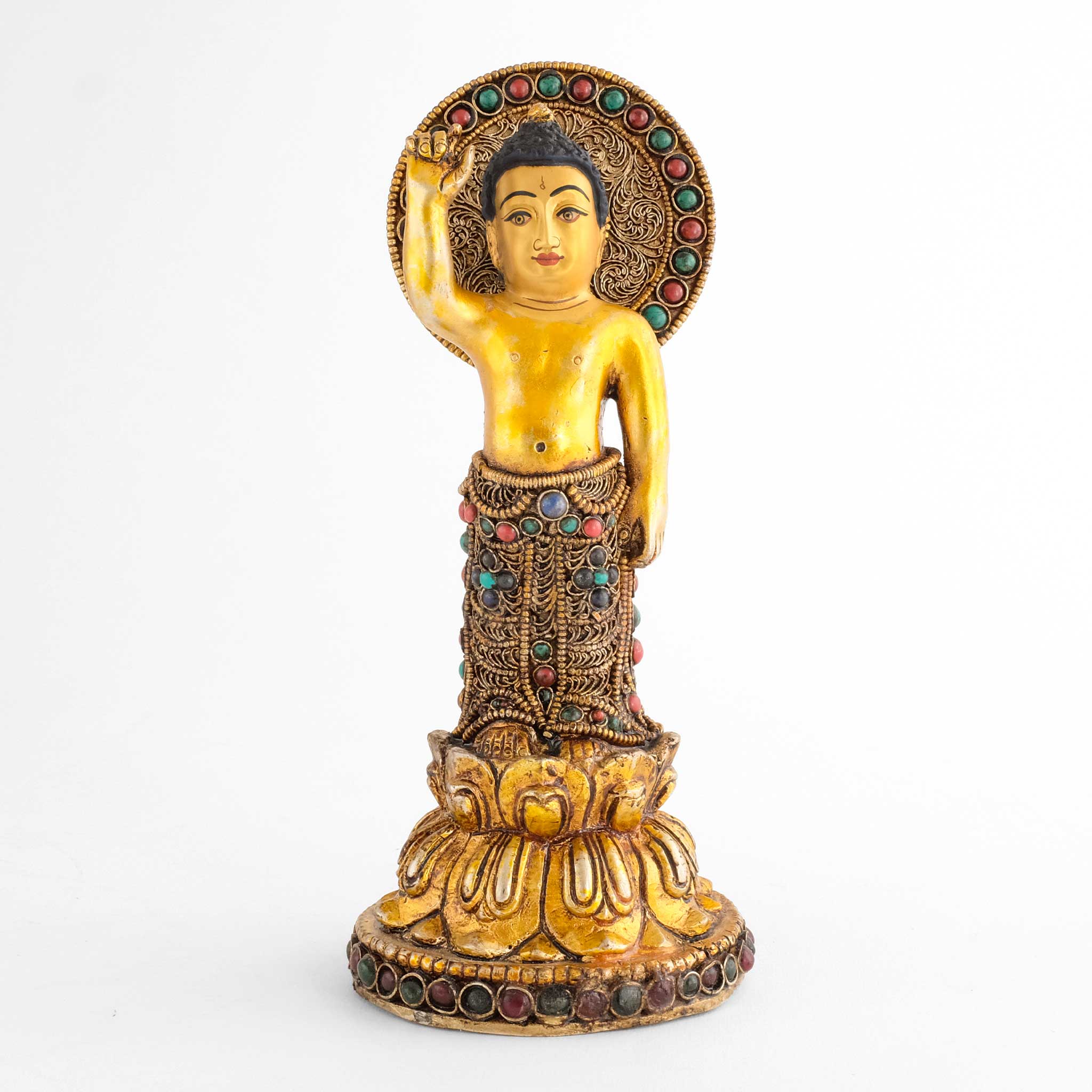 Siddhartha Gautama Buddha Statue, mit ausgestrecktem Finger. Nimbus und Robe sind mit feinem Filigran verziert und mit farbigen Steinen akzentuiert. 