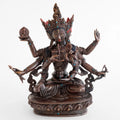 Namgyal Statue mit 8 Armen und 3 Gesichtern. Sie ist warmbraun oxidiert und mit kleinen Türkis-Steinen besetzt.
